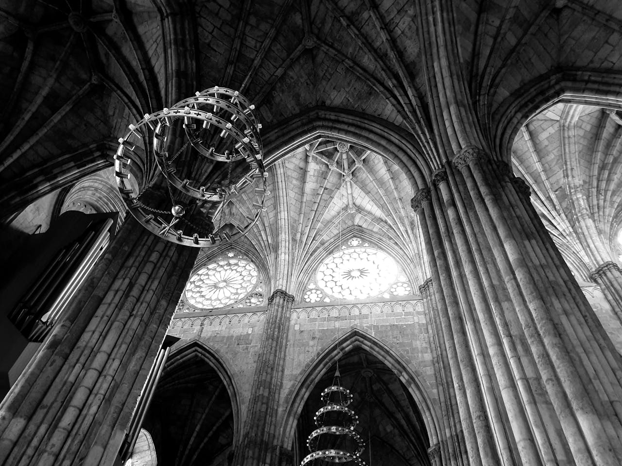 about-04 Monochrome shot of a cathedral interior showcasing gothic arches and chandeliers in Guadalajara.